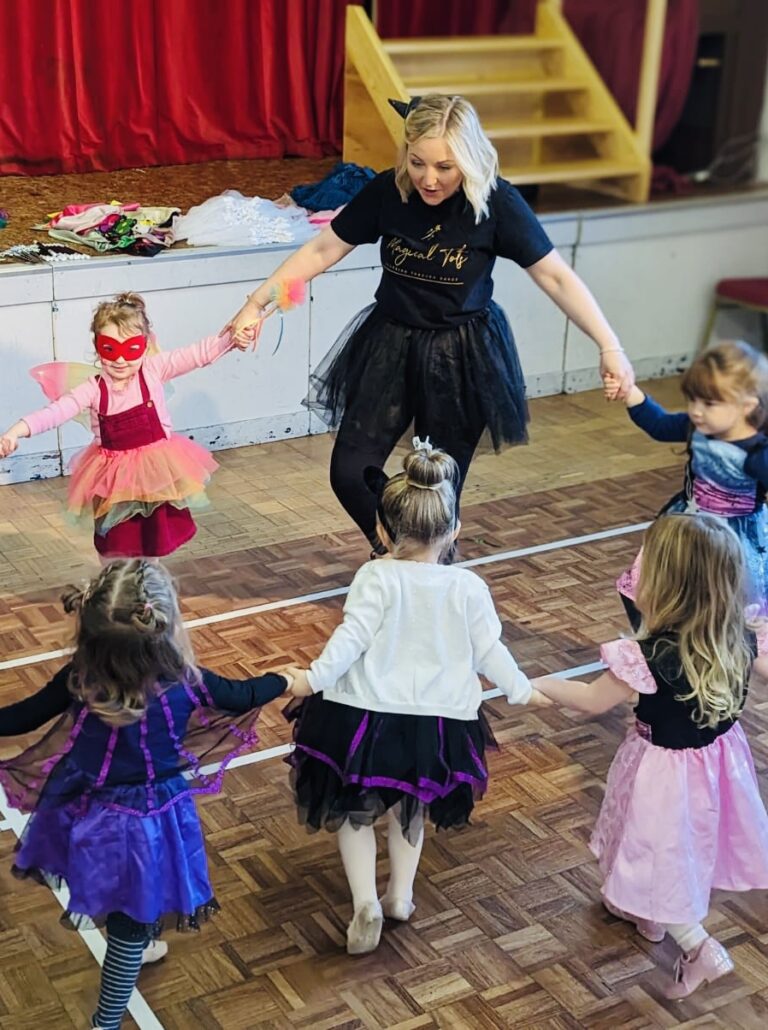 A joyful toddler and young child dancing in a bright, engaging studio at Magical Tots, where children's dance classes near me in Devon and Cornwall bring movement, creativity, and fun to life.