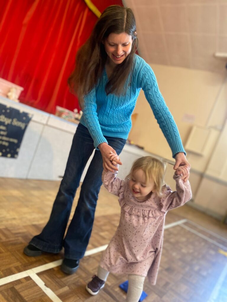 Mum and toddler bonding during balance beam play at Magical Tots – Dance Classes for Two Year Olds Near Me.